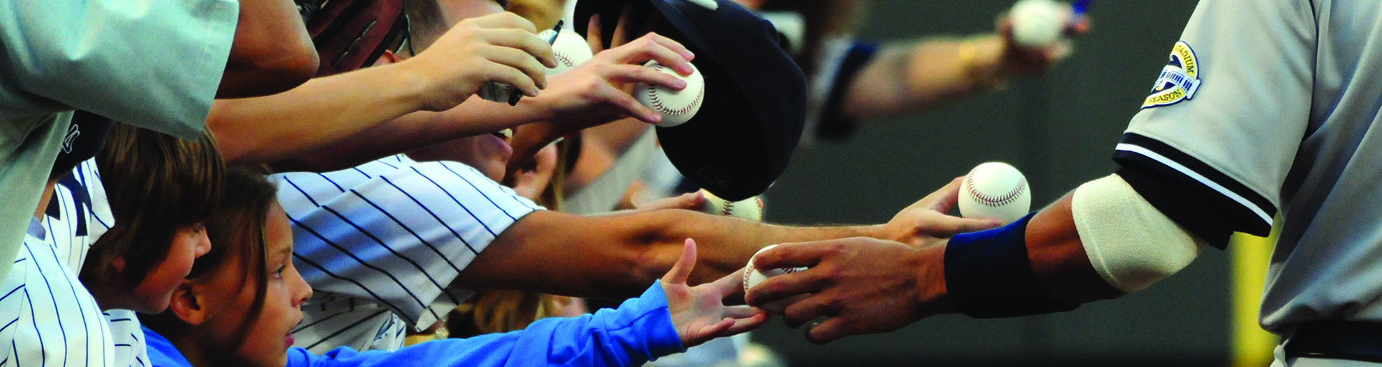 baseball player signing autographs